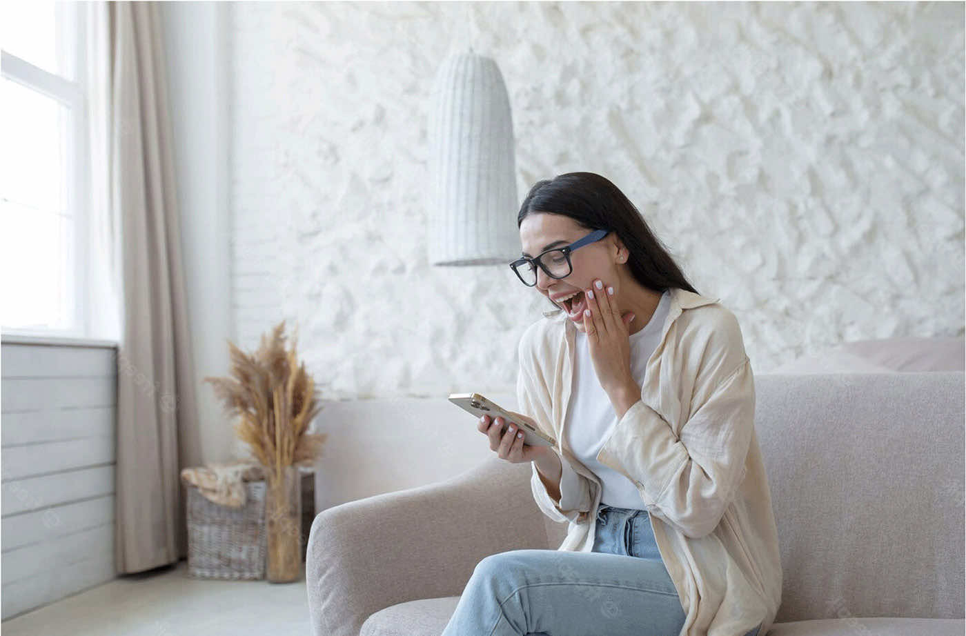 Happy woman smiling at phone